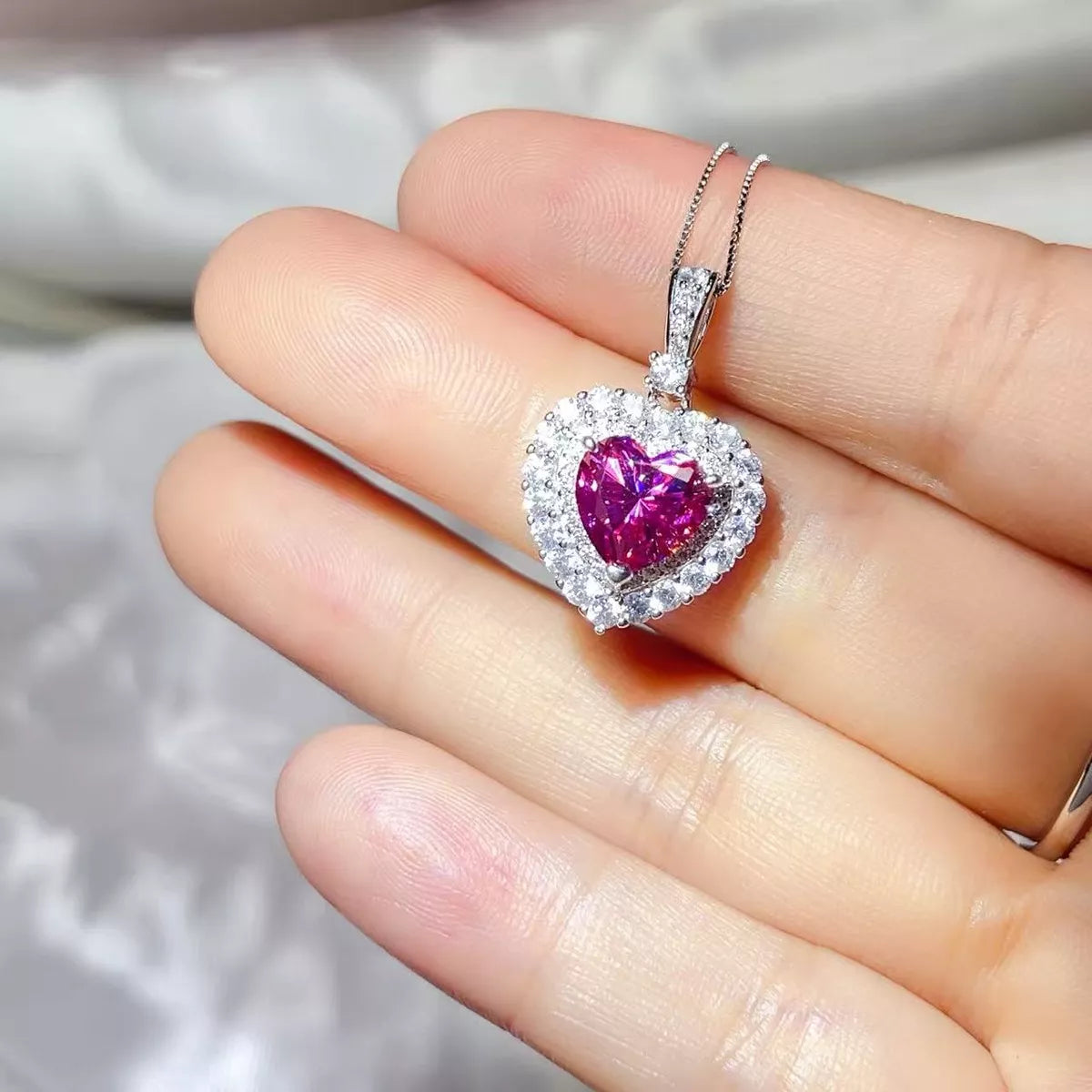 Starglow 1 carat hot pink moissanite necklace on a sterling silver chain, front view
