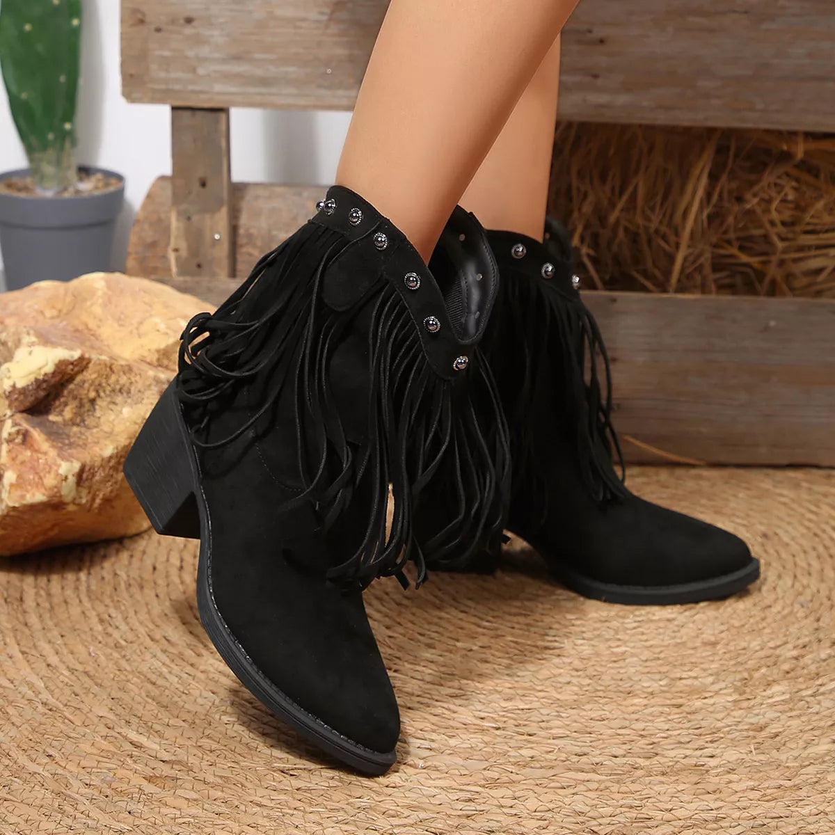 Fringed point toe boots styled on model