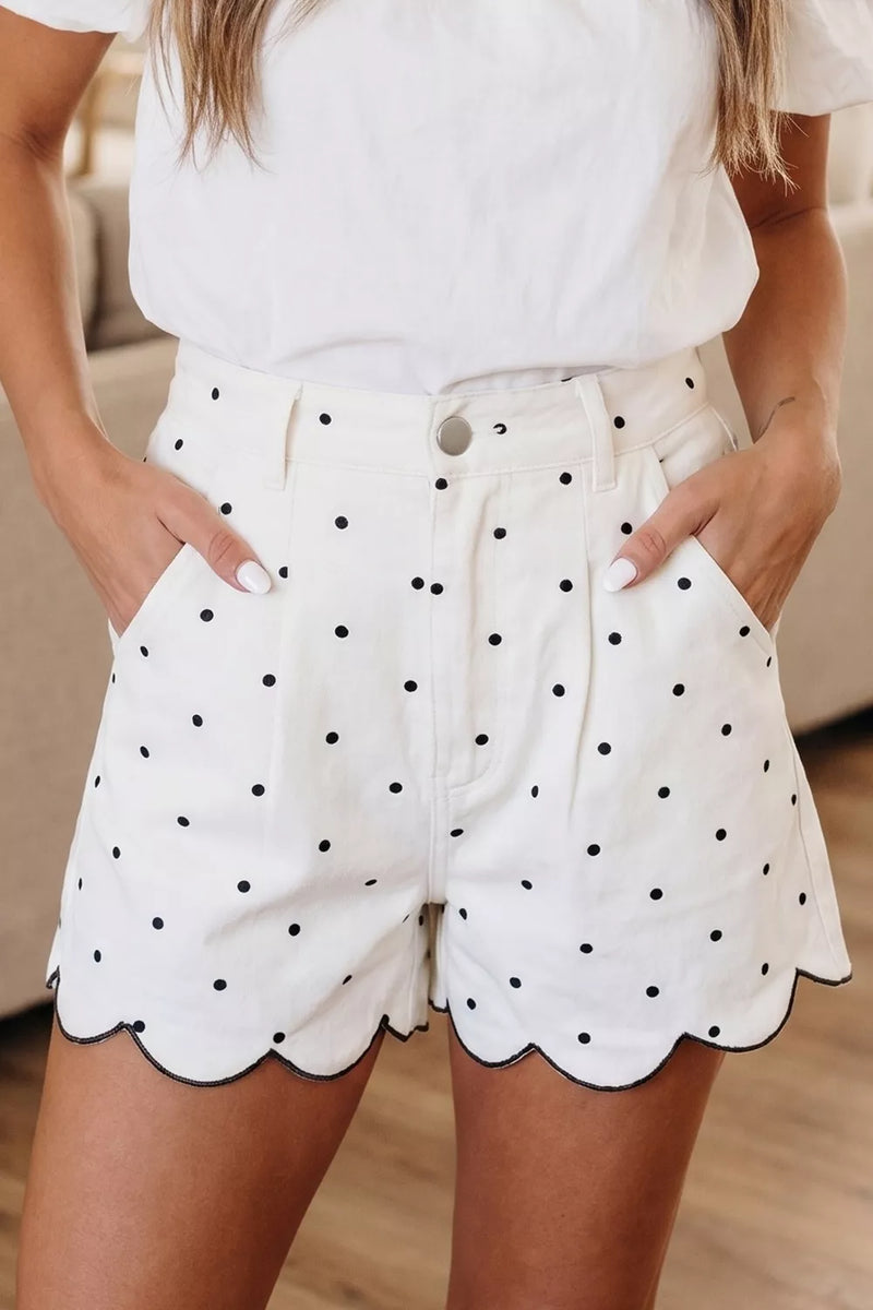 White polka dot shorts with scalloped hem front view