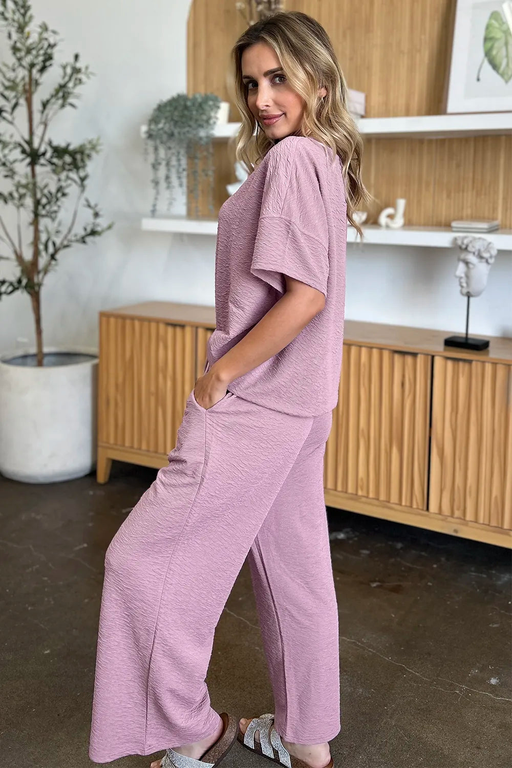 Two piece set pants detail showing drape and texture