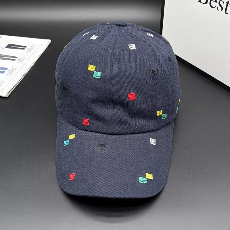 Navy embroidered baseball cap with small colourful motifs