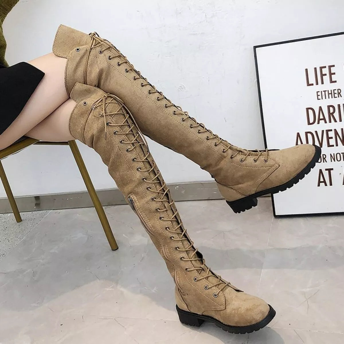 Lace up over the knee boots angled view
