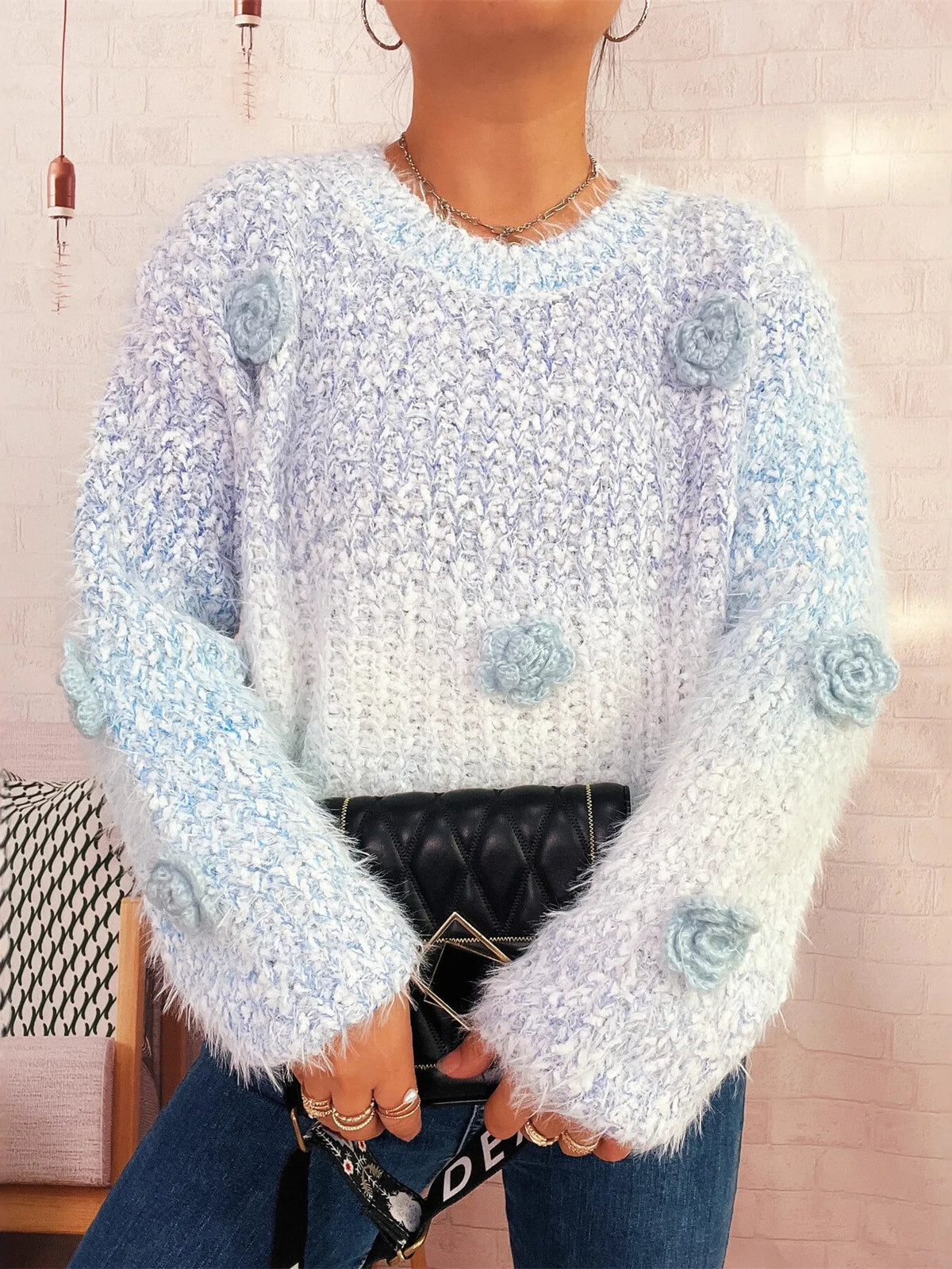 Flower embellished round neck sweater, styled with trousers