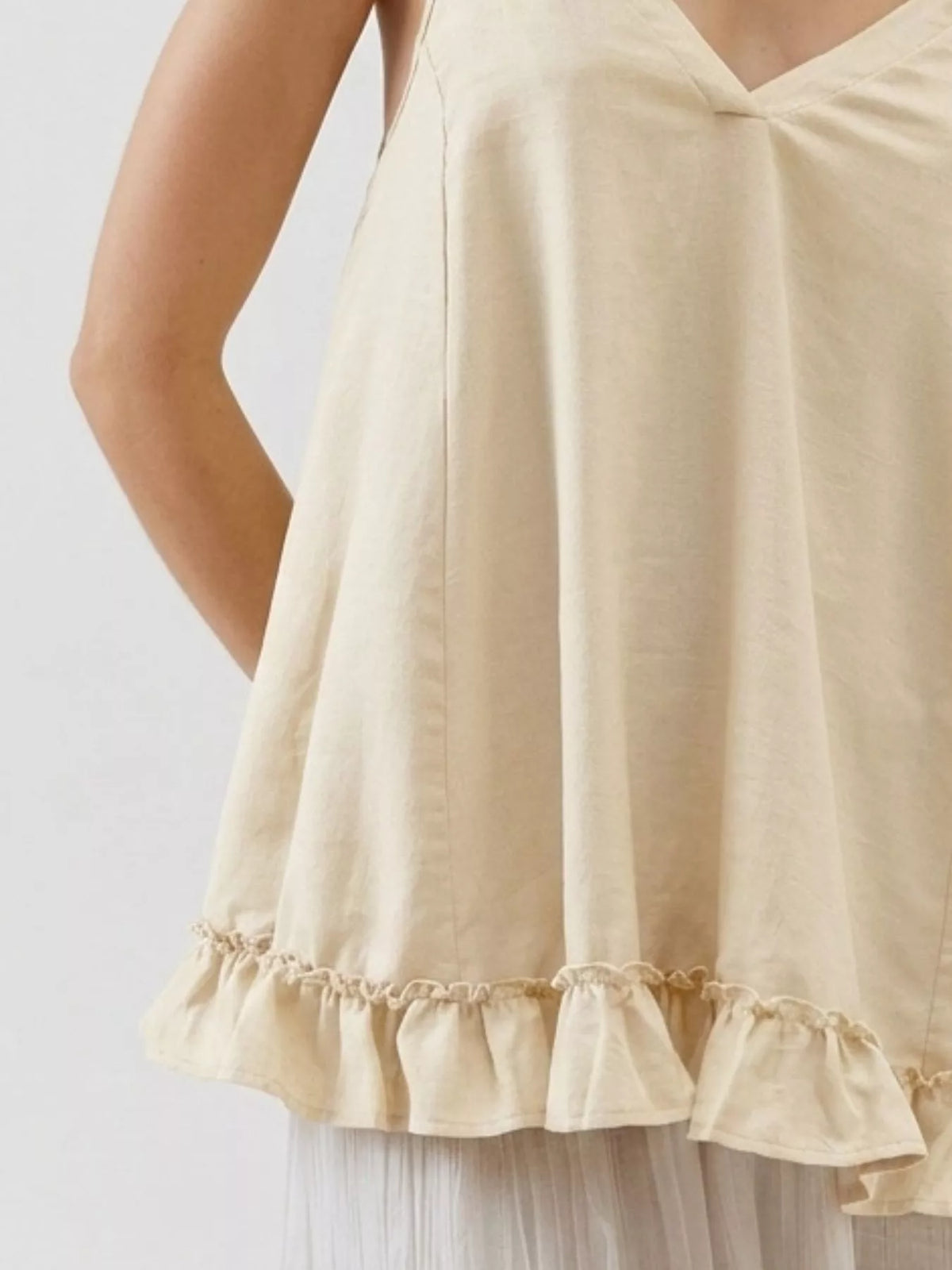 Tie strap ruffle hem cami angled view