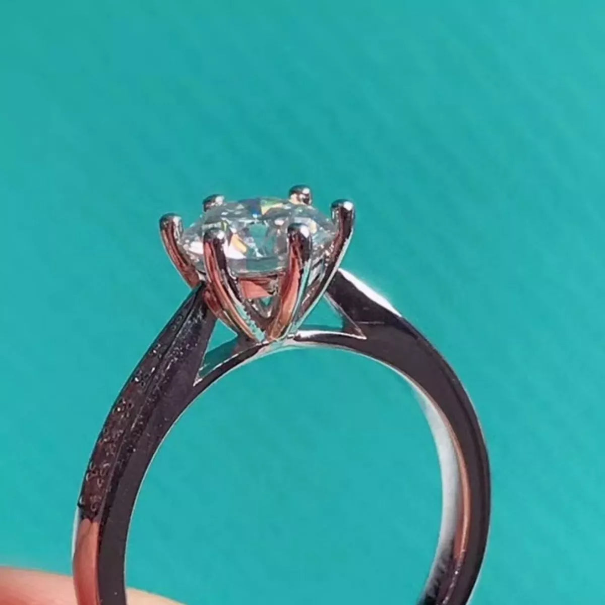 The moissanite ring shown on the hand