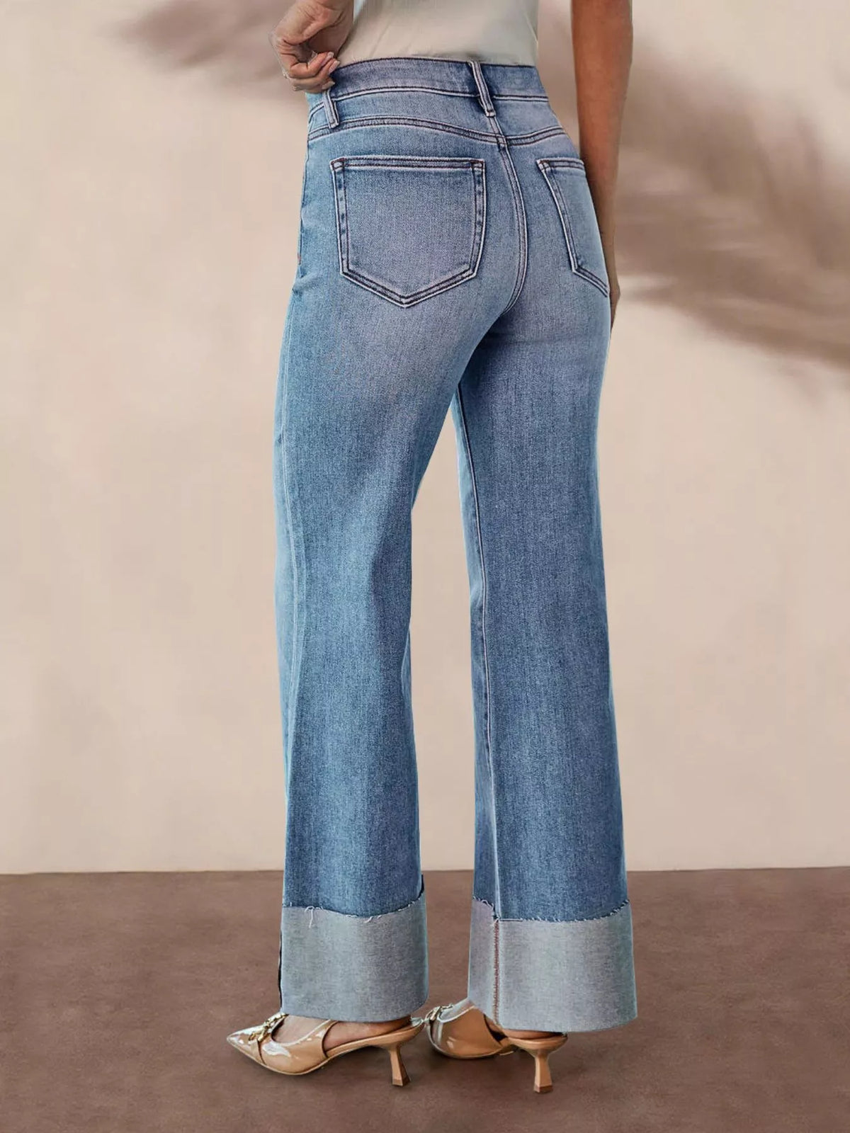 Full length styling of distressed flare jeans
