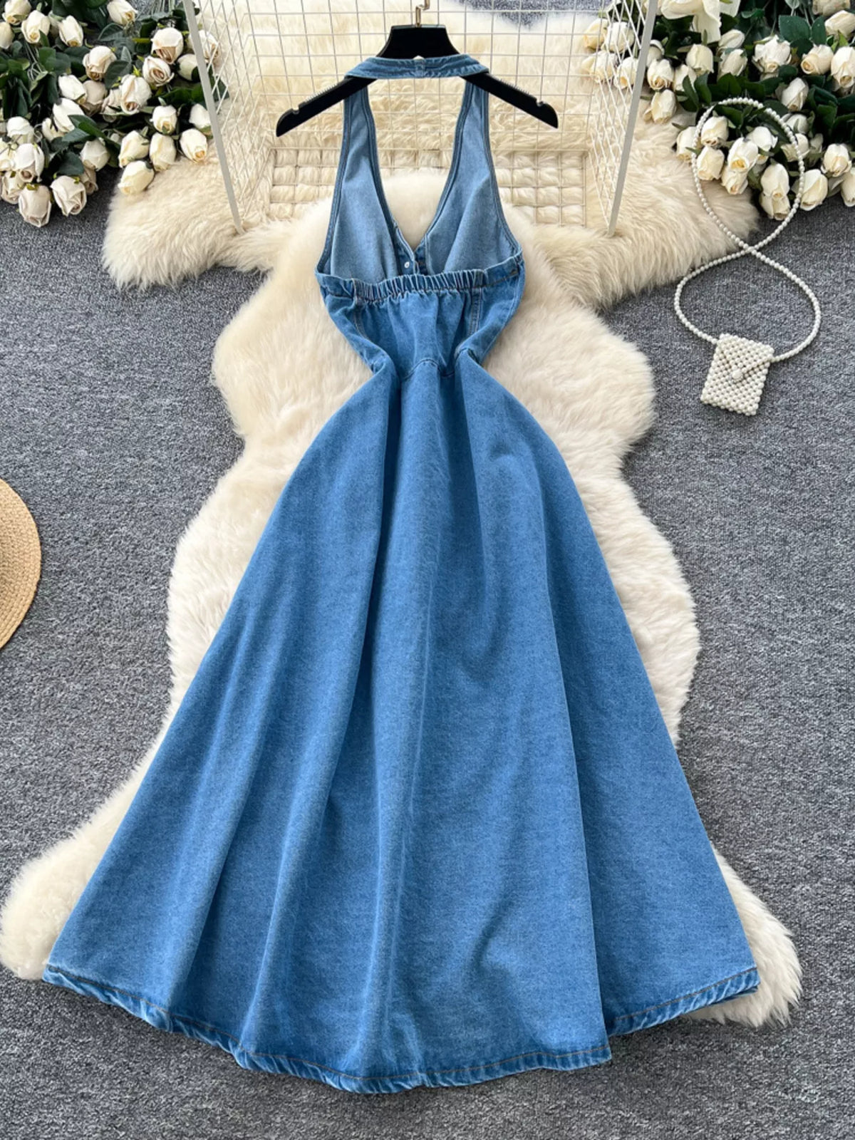 Blue halter neck button down denim dress styling detail