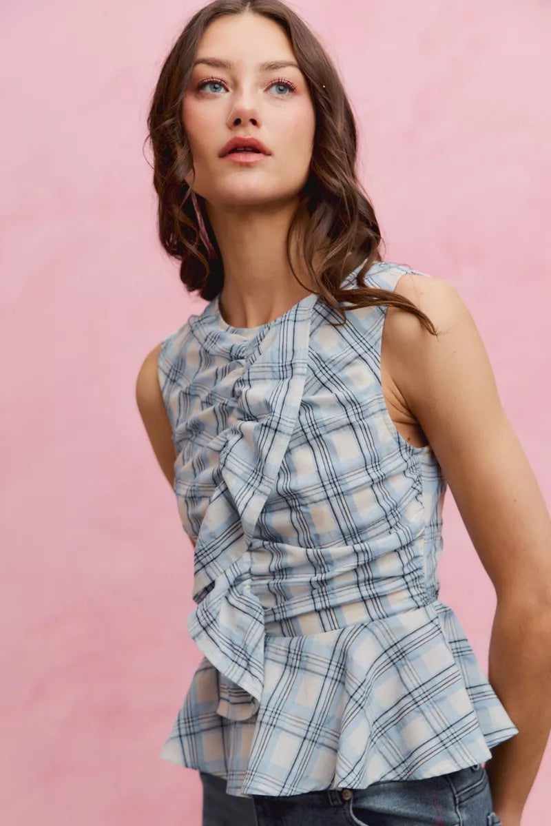 Blue plaid sleeveless ruffle peplum top front view