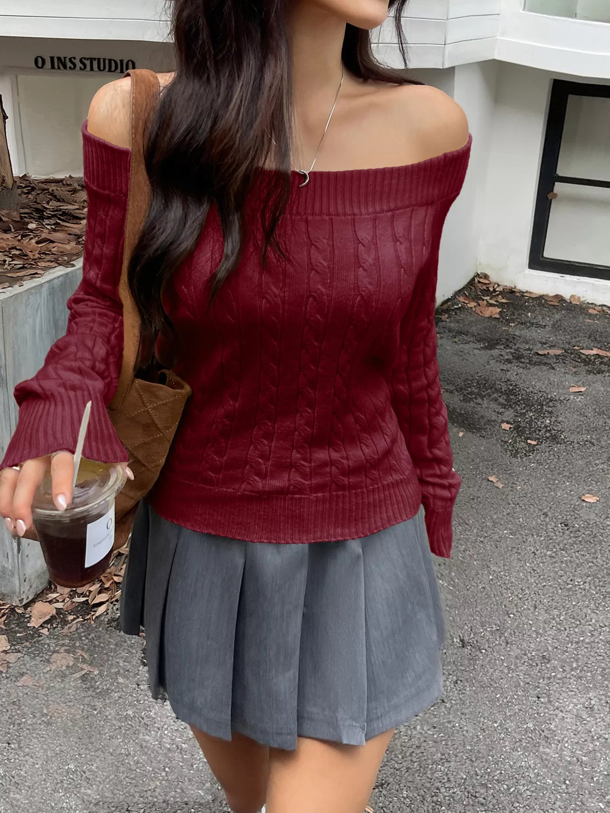 off shoulder cable knit sweater sleeve detail