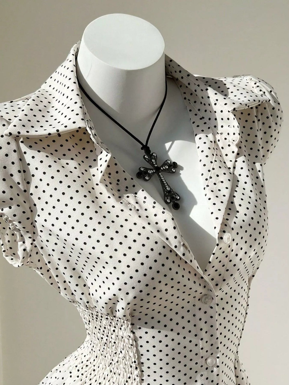 Apricot polka dot blouse shown from the side